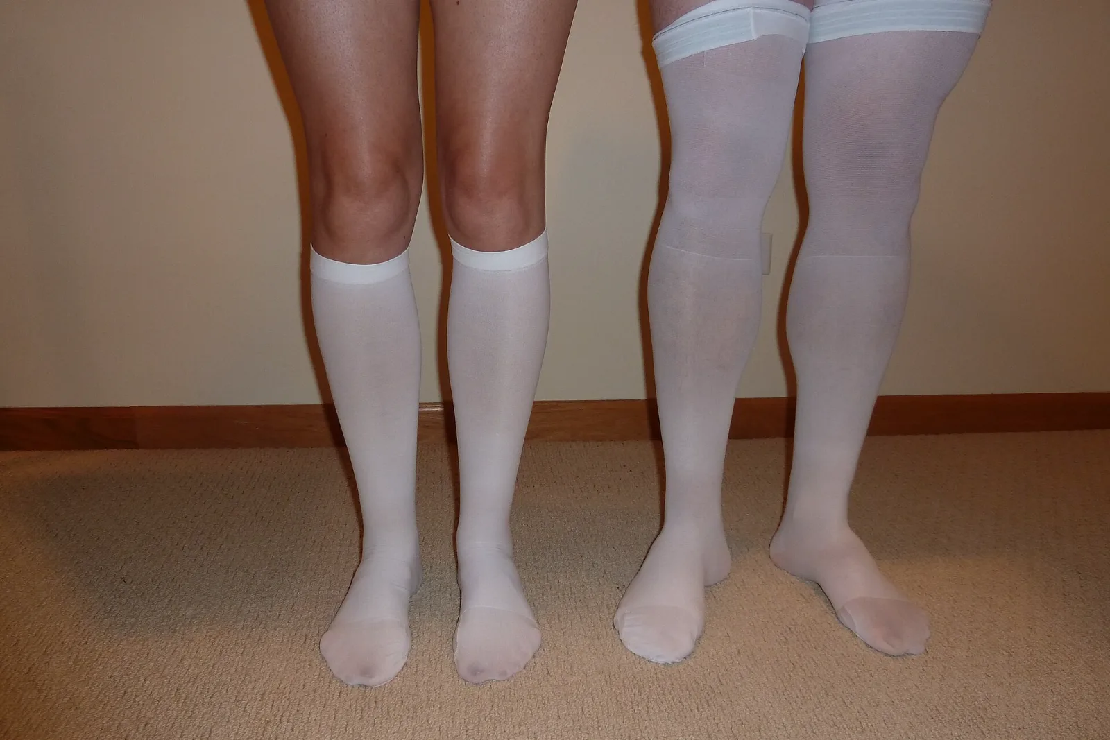 White knee-high and thigh-high anti-embolism stockings worn side by side
